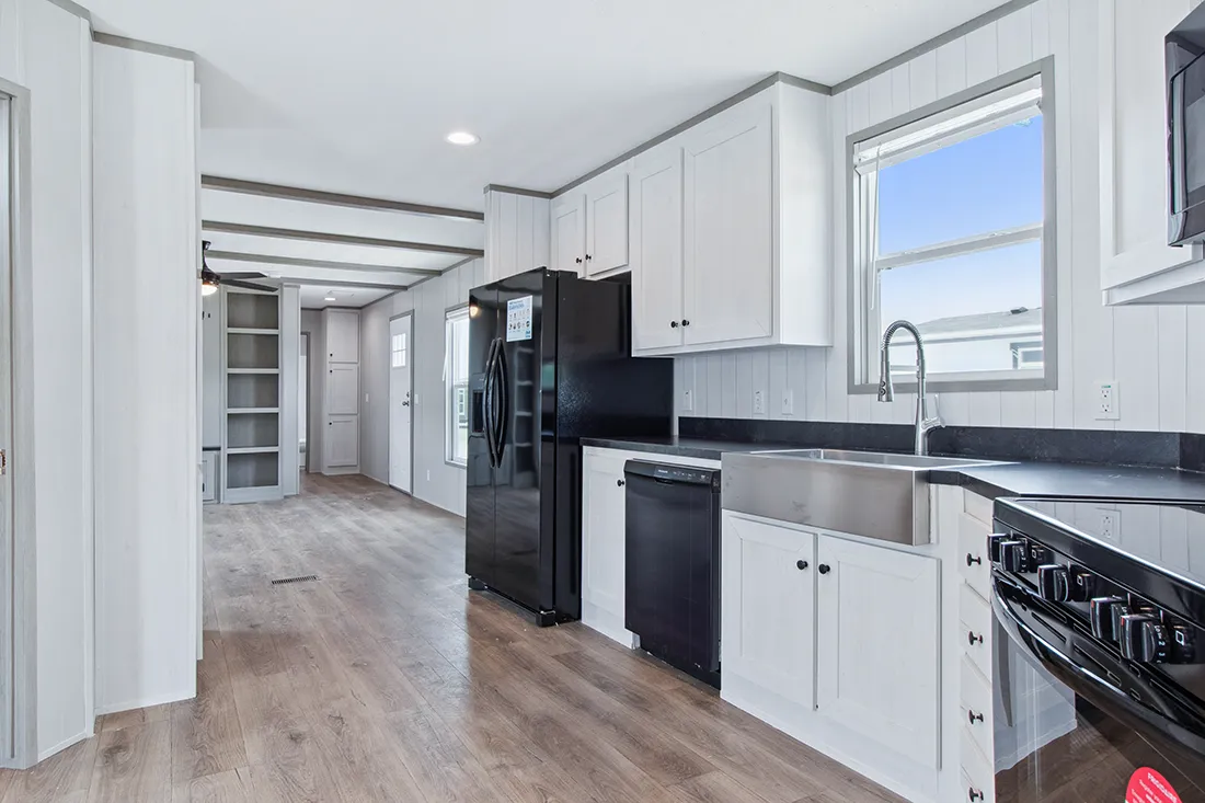 The ANNIVERSARY 16682F Kitchen. This Manufactured Mobile Home features 2 bedrooms and 2 baths.