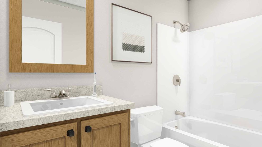 The UNDER PRESSURE Guest Bathroom. This Manufactured Mobile Home features 3 bedrooms and 2 baths.