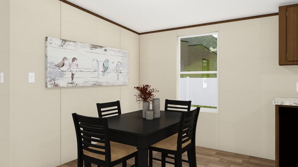 The SATISFACTION Dining Area. This Manufactured Mobile Home features 3 bedrooms and 2 baths.