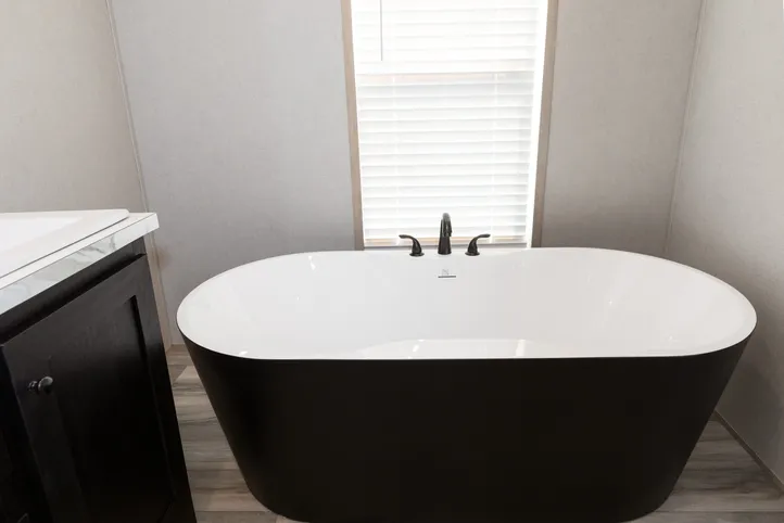 The THE ANNIVERSARY ISLANDER Primary Bathroom. This Manufactured Mobile Home features 3 bedrooms and 2 baths.