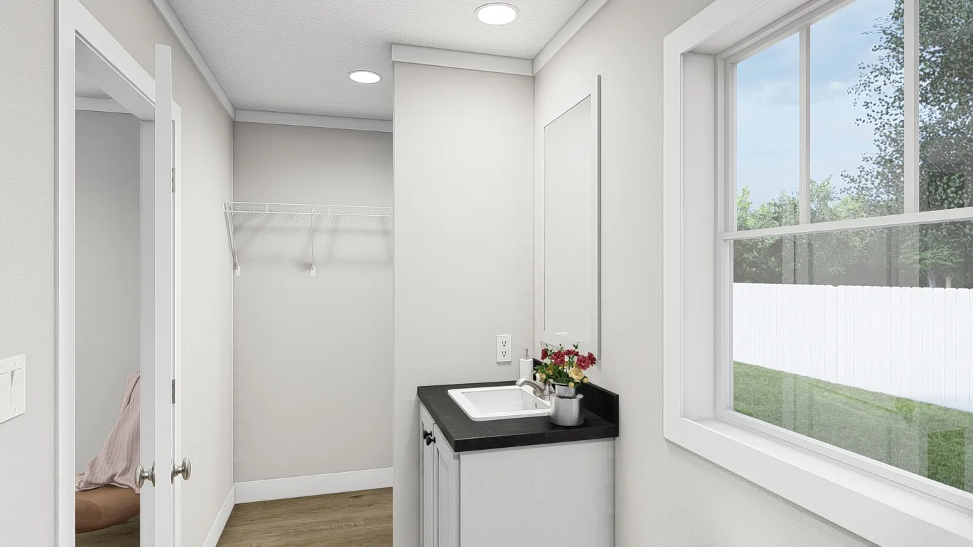 The MOVE ON UP Primary Bathroom. This Manufactured Mobile Home features 3 bedrooms and 2 baths.