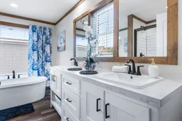 The LIZZIE Primary Bathroom. This Manufactured Mobile Home features 3 bedrooms and 2 baths.