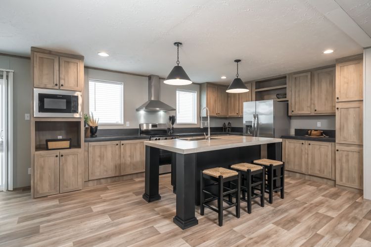 The TRADITION 72 Kitchen. This Manufactured Mobile Home features 4 bedrooms and 2 baths.