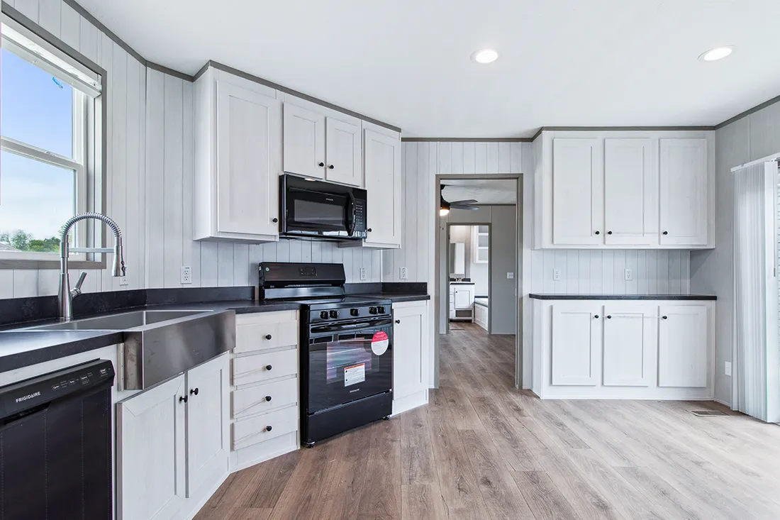 The ANNIVERSARY 16682F Kitchen. This Manufactured Mobile Home features 2 bedrooms and 2 baths.