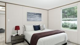 The TRIUMPH Guest Bedroom. This Manufactured Mobile Home features 5 bedrooms and 3 baths.