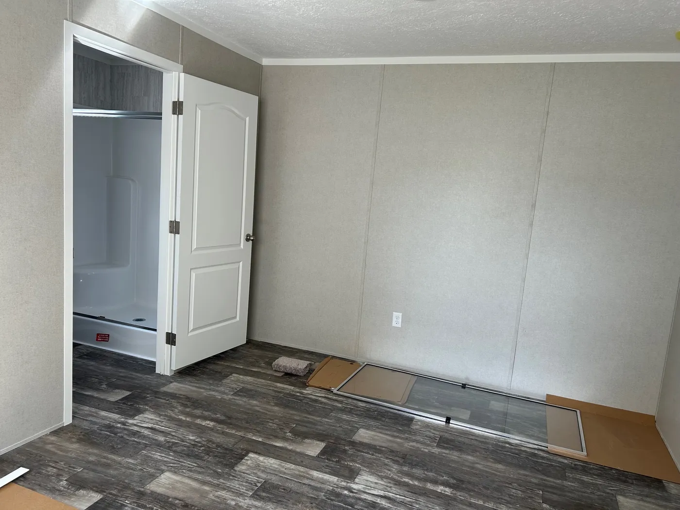 The SAPPHIRE XL 8016-644 Primary Bedroom. This Manufactured Mobile Home features 3 bedrooms and 2 baths.