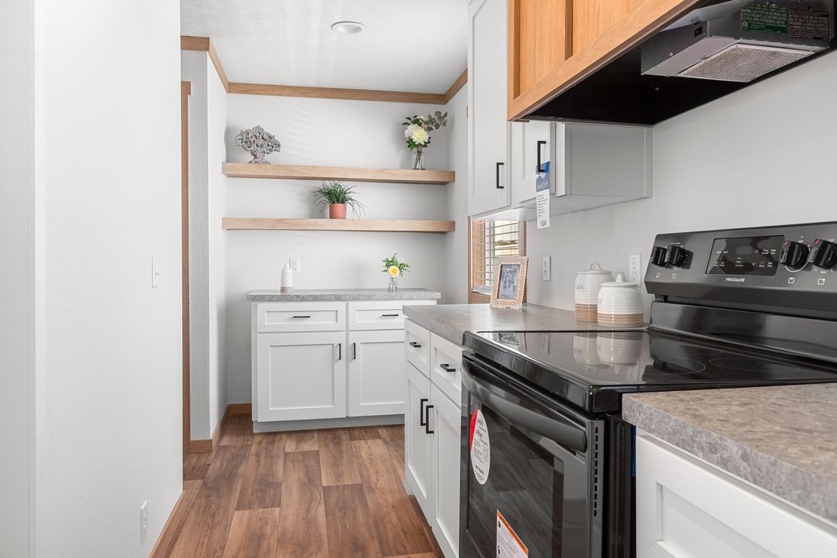The LORALEI Kitchen. This Manufactured Mobile Home features 3 bedrooms and 2 baths.