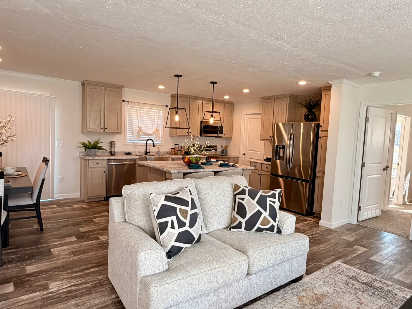 The TOURMALINE 7628-649 Living Room. This Manufactured Mobile Home features 4 bedrooms and 2 baths.