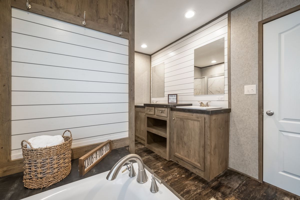 The MAJOR Primary Bathroom. This Manufactured Mobile Home features 3 bedrooms and 2 baths.
