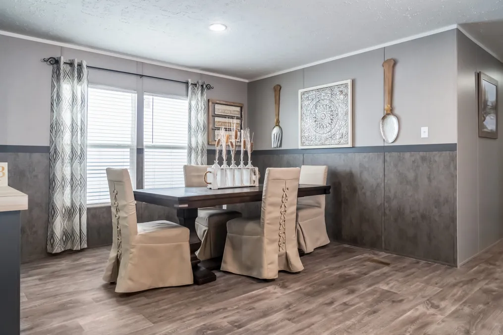The TRADITION 3268B Dining Room. This Manufactured Mobile Home features 5 bedrooms and 3 baths.
