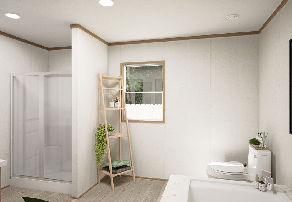 The THE MOUNTAINEER 68 Primary Bathroom. This Manufactured Mobile Home features 4 bedrooms and 2 baths.
