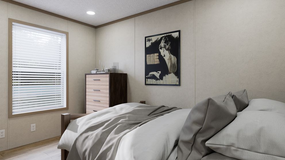 The 4814-CC04 RESOLVE 48 Primary Bedroom. This Manufactured Mobile Home features 2 bedrooms and 1 bath.