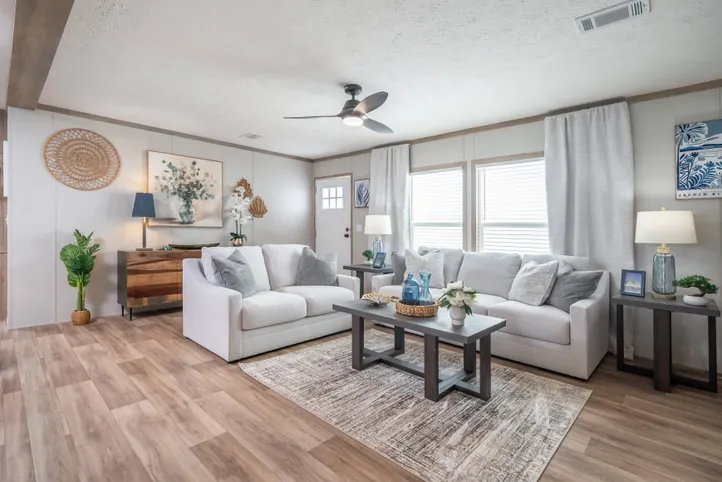The EL SUENO BREEZE Living Room. This Manufactured Mobile Home features 4 bedrooms and 2 baths.
