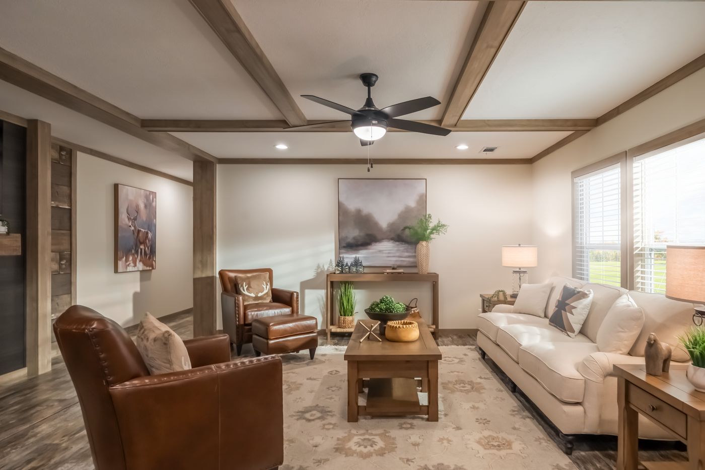 The BOUJEE PREMIER Living Room. This Manufactured Mobile Home features 4 bedrooms and 2 baths.