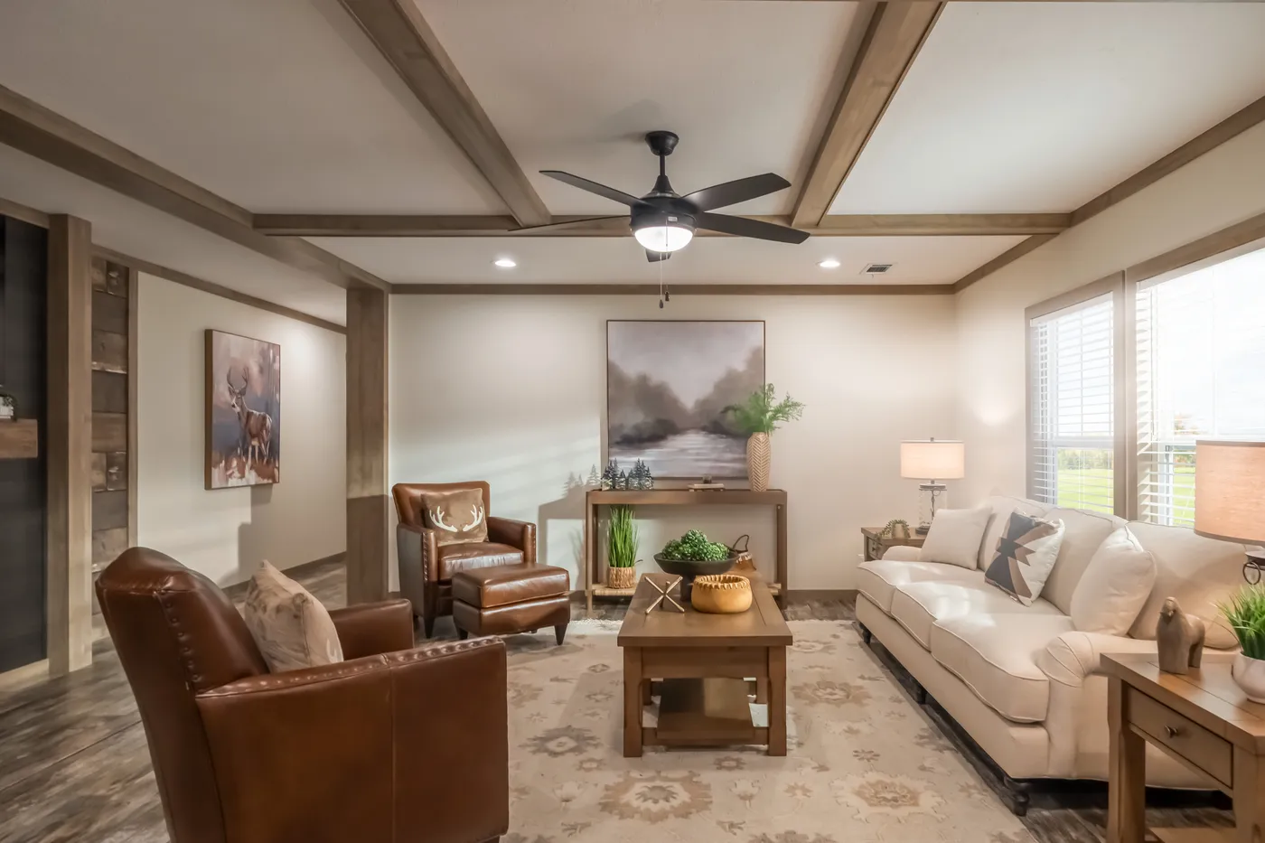 The BOUJEE PREMIER Living Room. This Manufactured Mobile Home features 4 bedrooms and 2 baths.