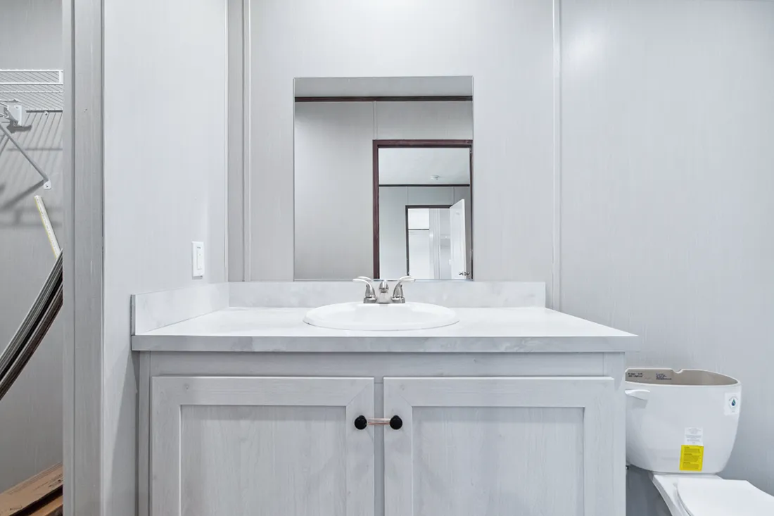 The HOMESTEAD 16562A Primary Bathroom. This Manufactured Mobile Home features 2 bedrooms and 2 baths.