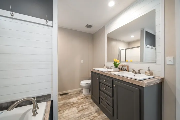 The ANNIVERSARY CHOICE Primary Bathroom. This Manufactured Mobile Home features 3 bedrooms and 2 baths.