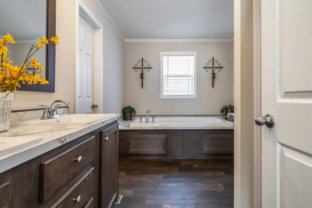 The MAVERICK 56A Primary Bathroom. This Manufactured Mobile Home features 3 bedrooms and 2 baths.