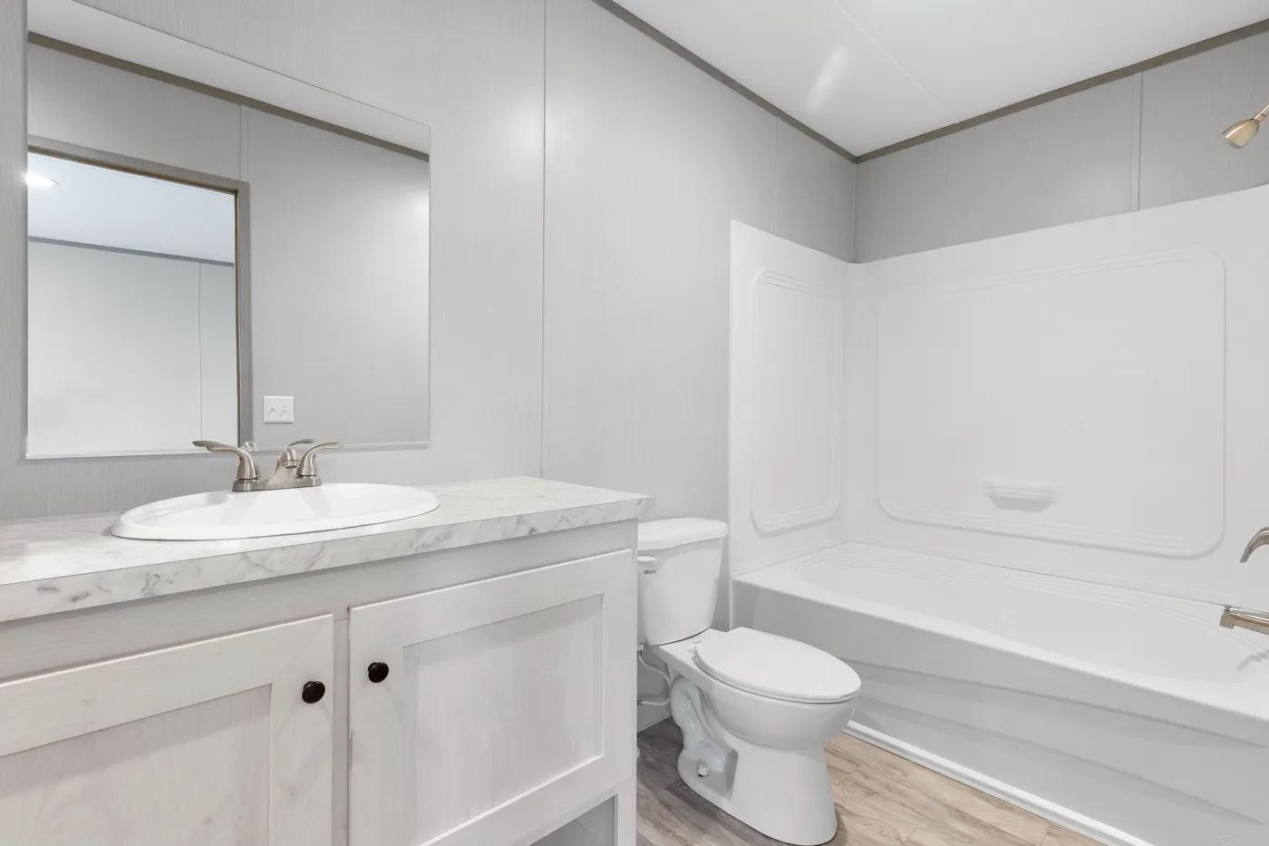 The BREEZE 16602A Primary Bathroom. This Manufactured Mobile Home features 2 bedrooms and 2 baths.