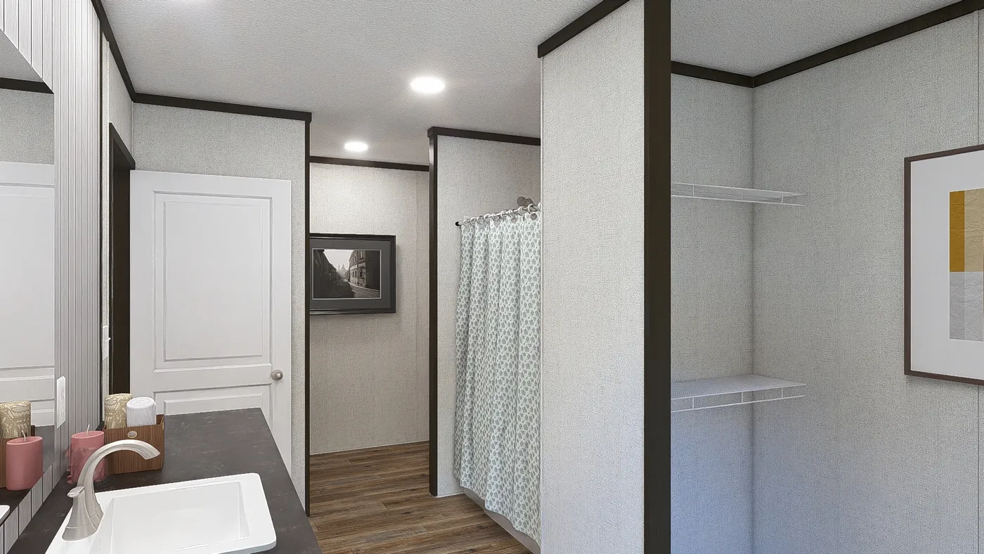 The FESTIVAL Primary Bathroom. This Manufactured Mobile Home features 3 bedrooms and 2 baths.
