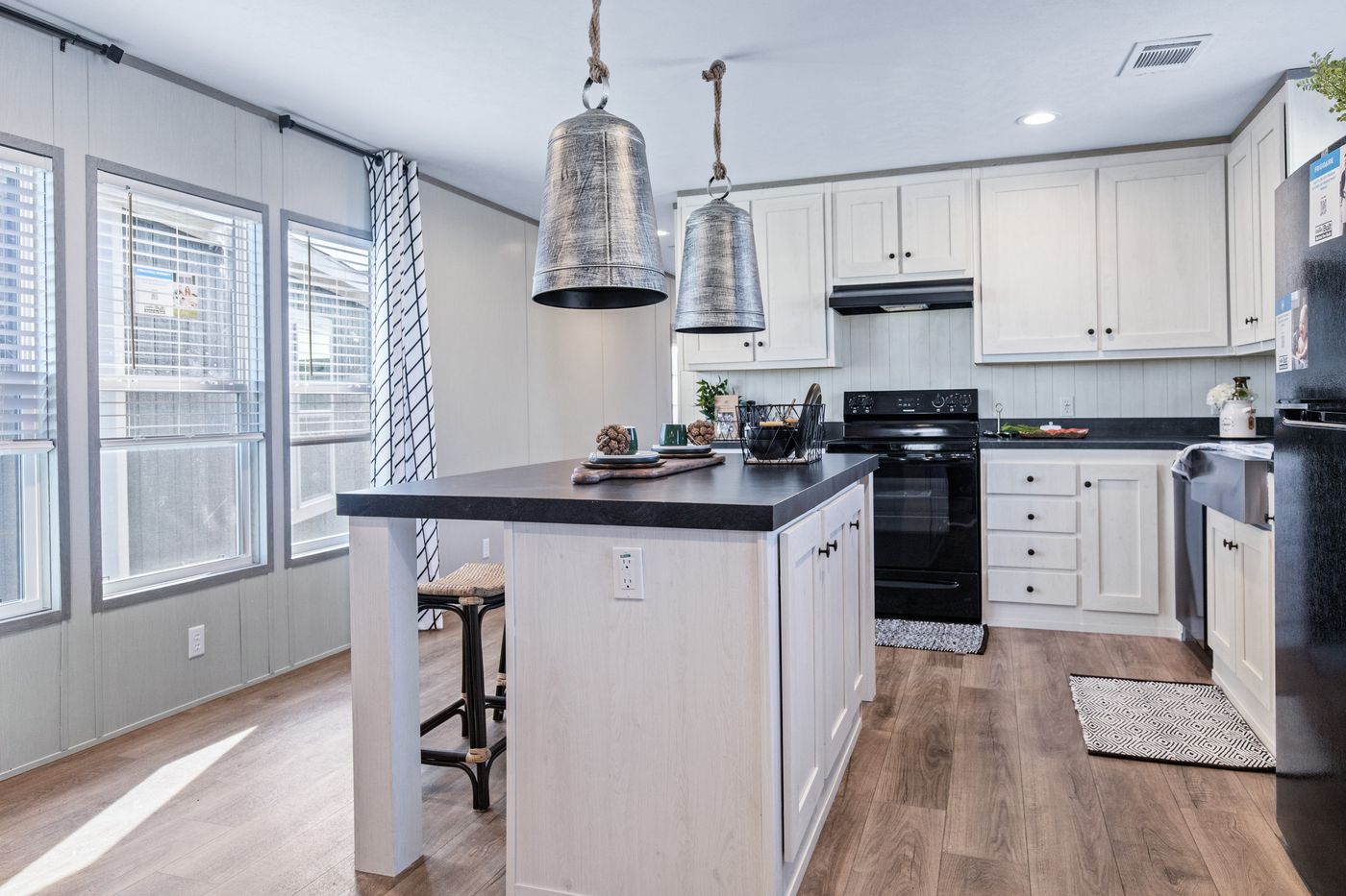 The PORCH LIVING SERIES 16682A Kitchen. This Manufactured Mobile Home features 2 bedrooms and 2 baths.