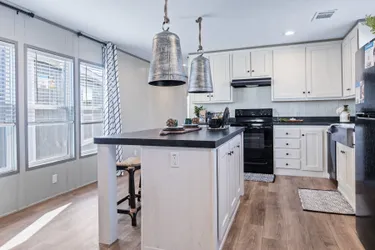 The PORCH LIVING SERIES 16682A Kitchen. This Manufactured Mobile Home features 2 bedrooms and 2 baths.