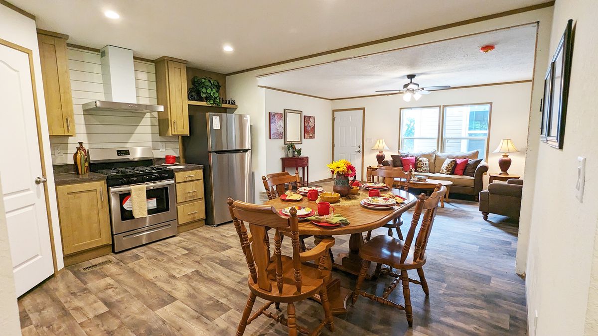 The LIFESTYLE 65-2 Kitchen. This Manufactured Mobile Home features 3 bedrooms and 2 baths.