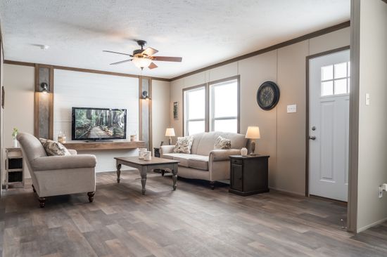 The FARMHOUSE BREEZE 72 Living Room. This Manufactured Mobile Home features 4 bedrooms and 2 baths.
