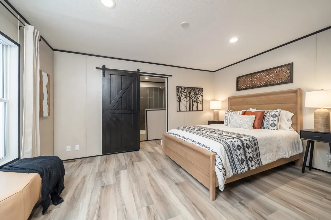 The THE SMOKEY Primary Bedroom. This Manufactured Mobile Home features 3 bedrooms and 2 baths.