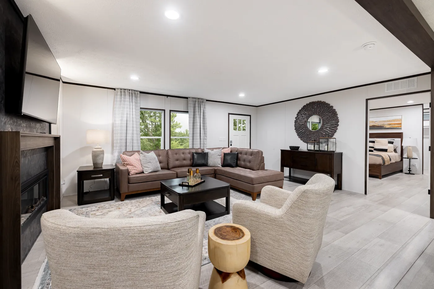 The CRESTWOOD Living Room. This Manufactured Mobile Home features 3 bedrooms and 2 baths.