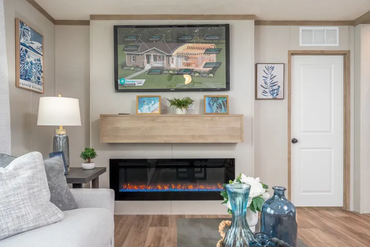 The EL SUENO BREEZE Living Room. This Manufactured Mobile Home features 4 bedrooms and 2 baths.