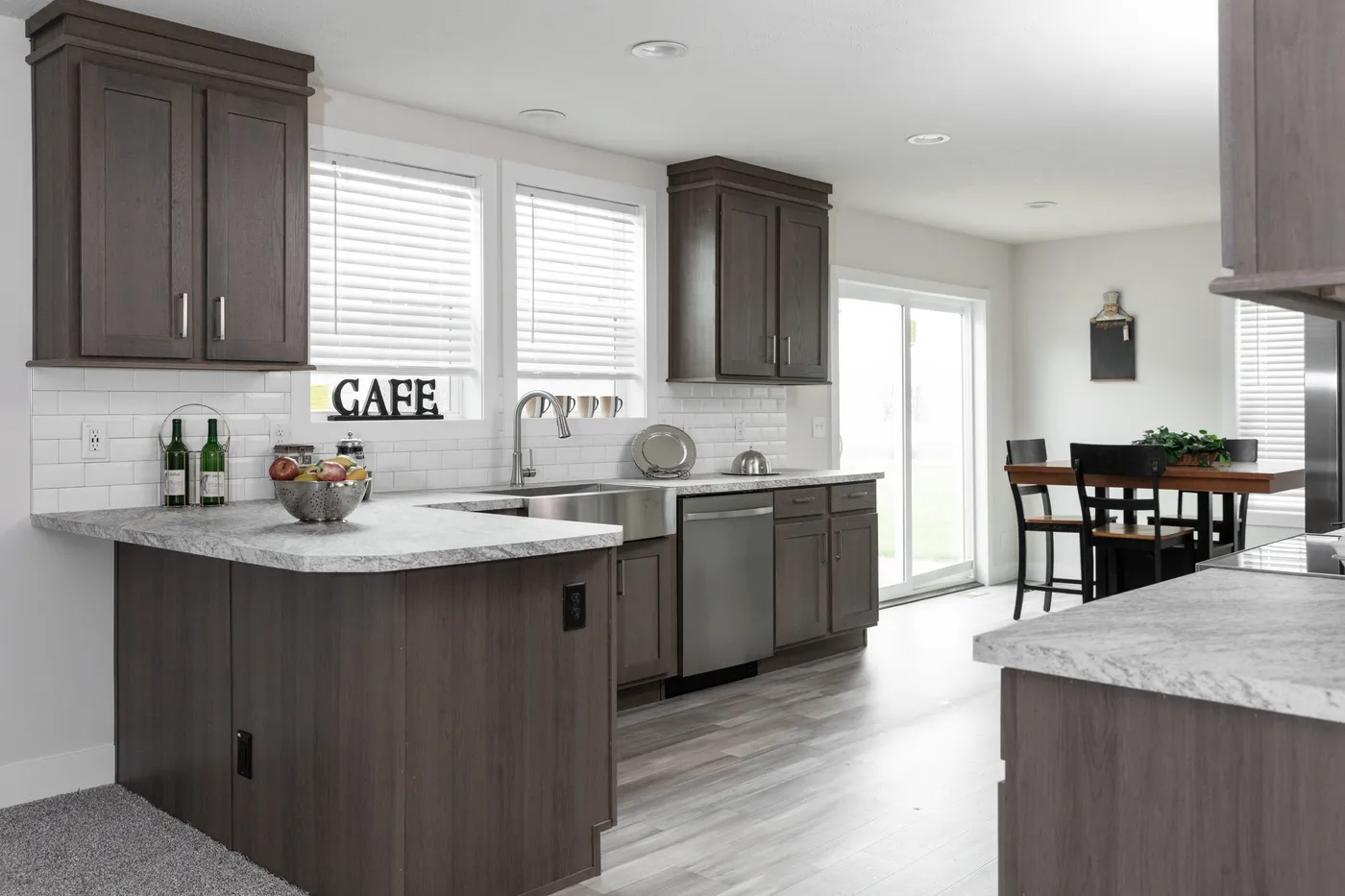 The HILL ST/5628-MS020-1 SECT Kitchen. This Manufactured Mobile Home features 3 bedrooms and 2 baths.