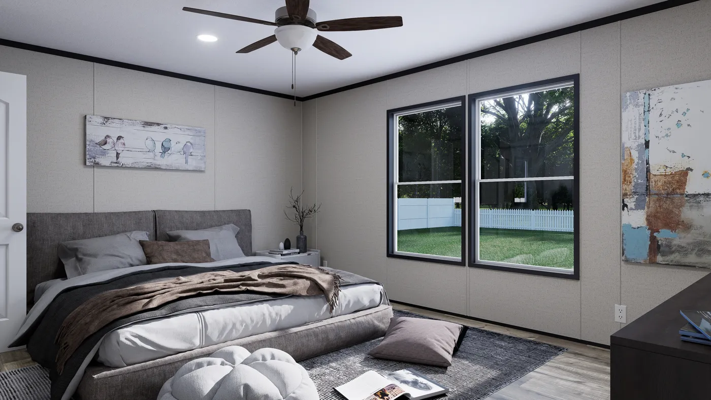 The THE MOUNTAINEER 52 Primary Bedroom. This Manufactured Mobile Home features 3 bedrooms and 2 baths.