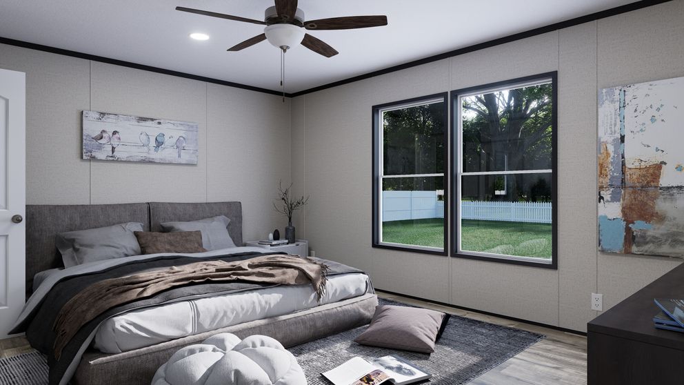 The THE MOUNTAINEER 52 Primary Bedroom. This Manufactured Mobile Home features 3 bedrooms and 2 baths.