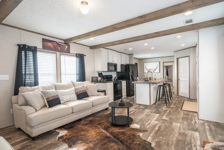 The RIVERHAVEN Living Room. This Manufactured Mobile Home features 3 bedrooms and 2 baths.
