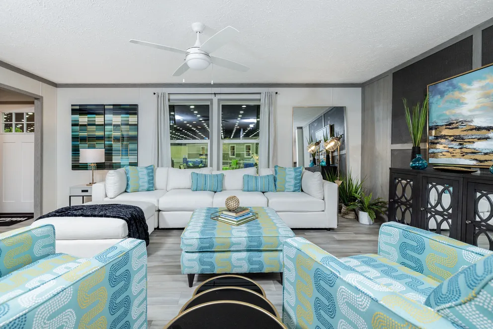 The 6428-E792 THE PULSE Living Room. This Manufactured Mobile Home features 3 bedrooms and 2.5 baths.