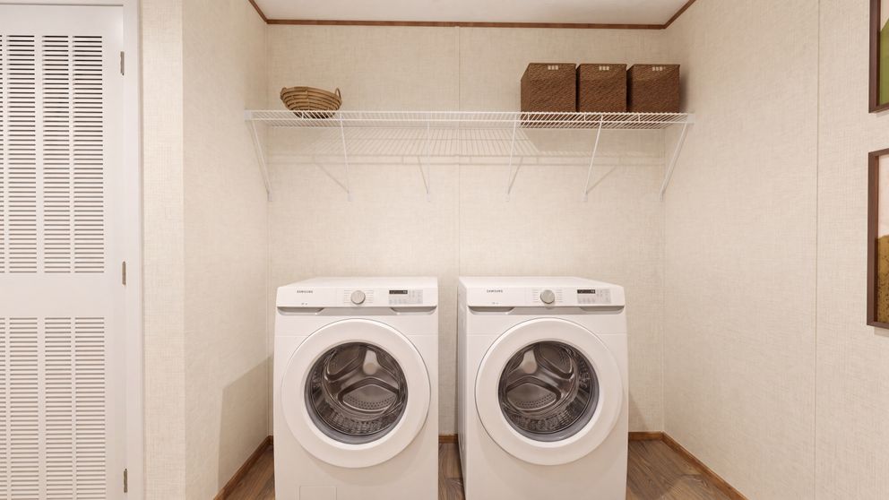 The REDWOOD Utility Room. This Manufactured Mobile Home features 5 bedrooms and 3 baths.