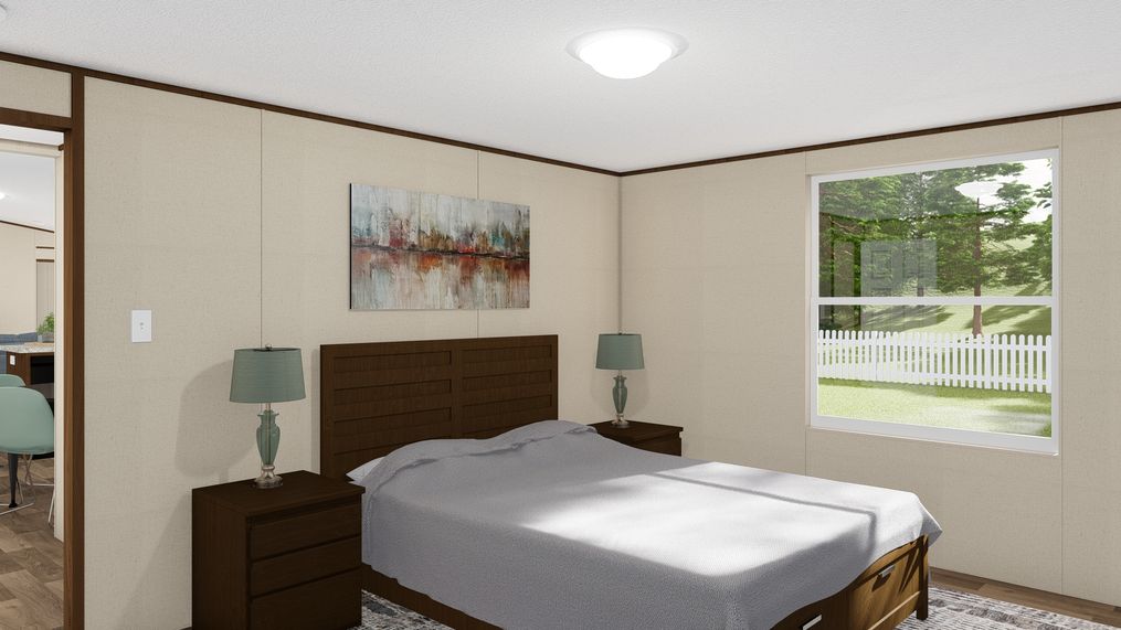 The DELIGHT Primary Bedroom. This Manufactured Mobile Home features 2 bedrooms and 2 baths.