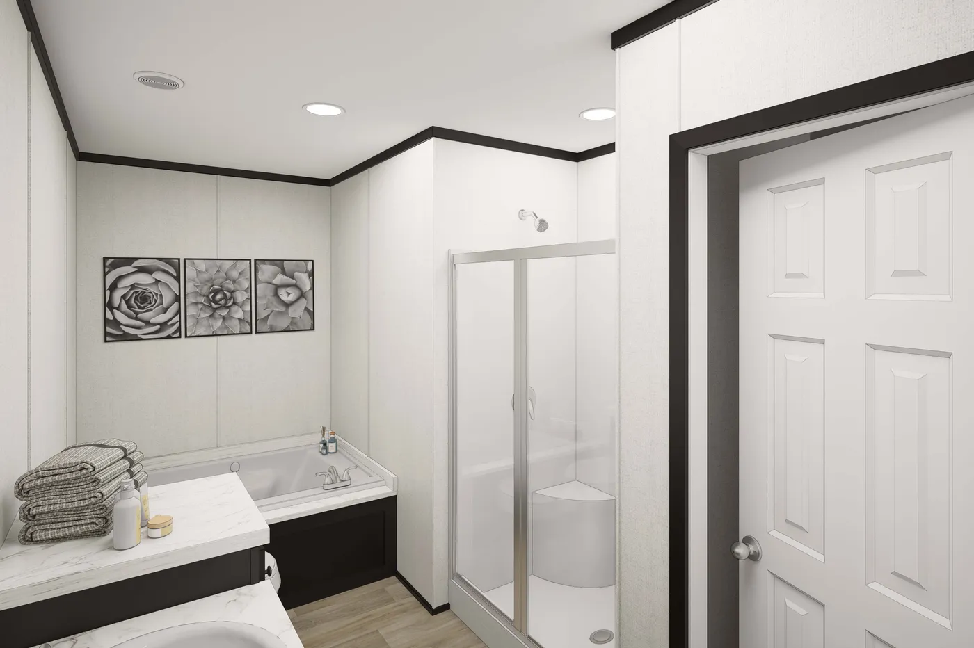 The PLATINUM ANNIVERSARY Primary Bathroom. This Manufactured Mobile Home features 3 bedrooms and 2 baths.