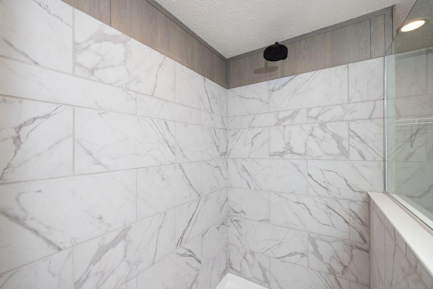 The SHOWER HOUSE Primary Bathroom. This Manufactured Mobile Home features 3 bedrooms and 2 baths.