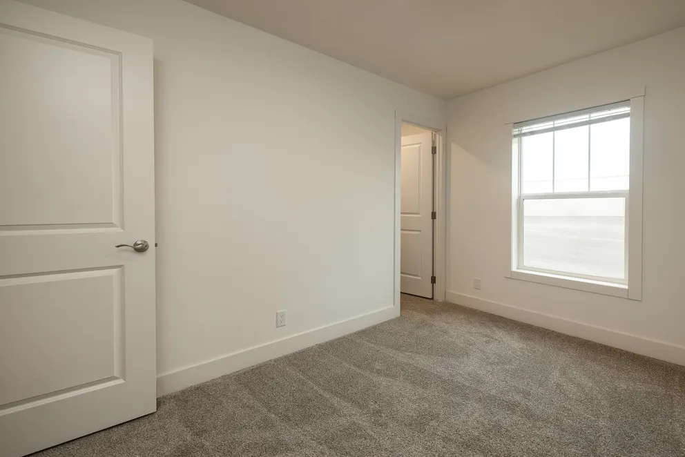 The HEY JUDE Bedroom. This Manufactured Mobile Home features 4 bedrooms and 2 baths.