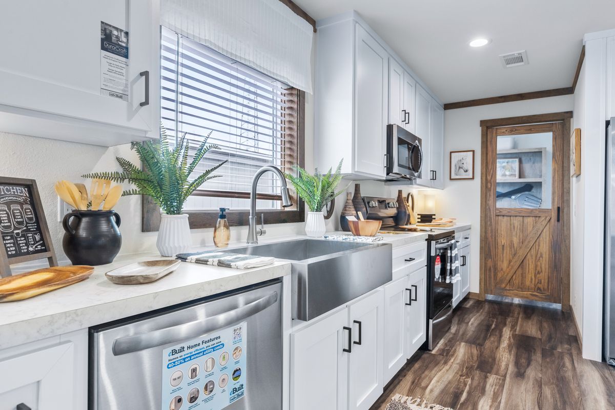 The LIZZIE Kitchen. This Manufactured Mobile Home features 3 bedrooms and 2 baths.