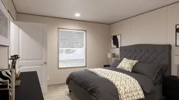 The BLAZER 76 4A Primary Bedroom. This Manufactured Mobile Home features 4 bedrooms and 2 baths.