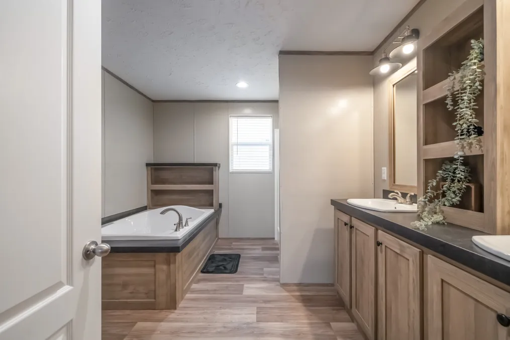 The TRADITION 72 Primary Bathroom. This Manufactured Mobile Home features 4 bedrooms and 2 baths.