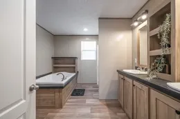 The TRADITION 72 Primary Bathroom. This Manufactured Mobile Home features 4 bedrooms and 2 baths.