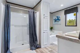 The COLOSSAL Primary Bathroom. This Manufactured Mobile Home features 3 bedrooms and 2 baths.