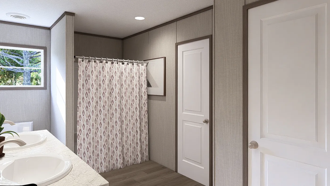 The LEGEND BIG BOY Primary Bathroom. This Manufactured Mobile Home features 4 bedrooms and 2 baths.