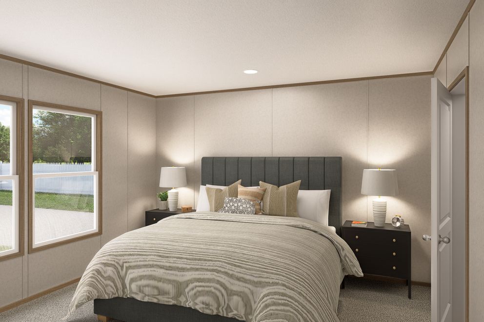 The THE EAGLE 52 Primary Bedroom. This Manufactured Mobile Home features 3 bedrooms and 2 baths.