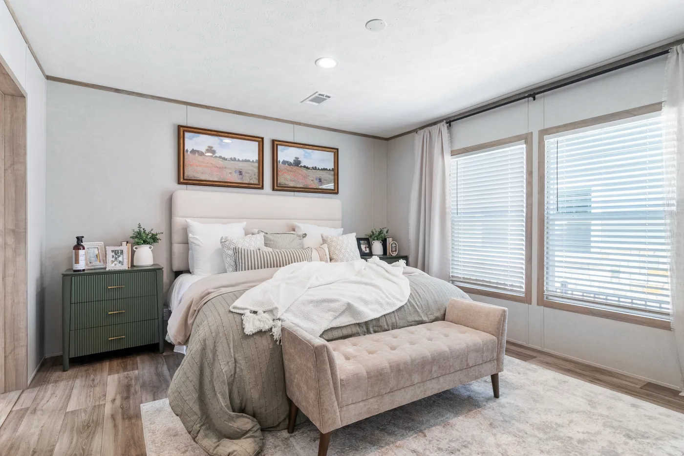 The THE REAL DEAL Primary Bedroom. This Manufactured Mobile Home features 3 bedrooms and 2 baths.