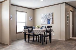 The FARMHOUSE BREEZE 72 Dining Area. This Manufactured Mobile Home features 4 bedrooms and 2 baths.